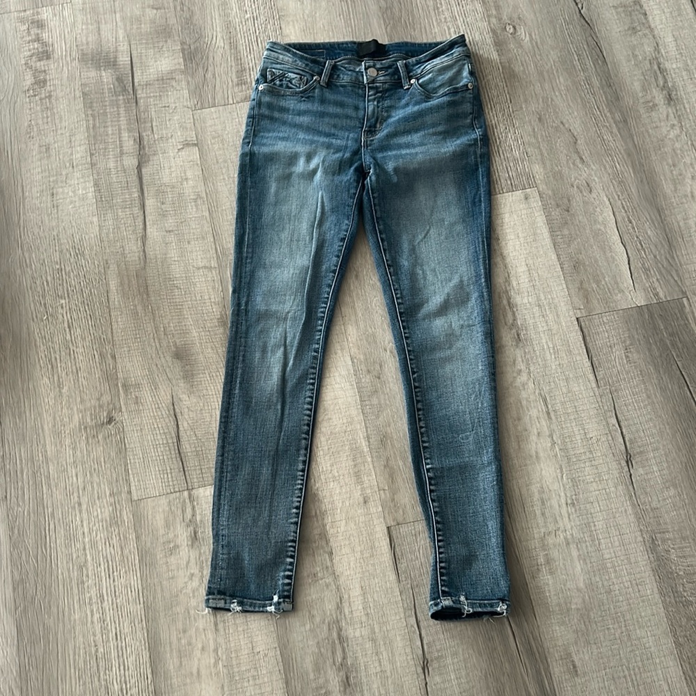 Buckle black skinny jeans.